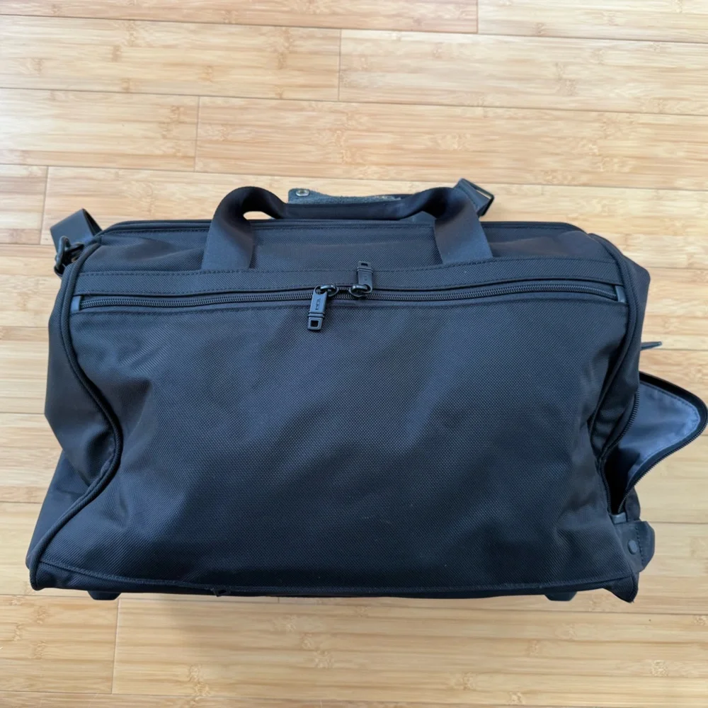 Tumi Black Duffel Bag with Adjustable Shoulder Strap